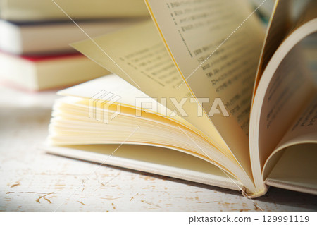 Autumn is the season for reading. Open a book (image) Autumn is the season for reading. Open a book (image) 129991119