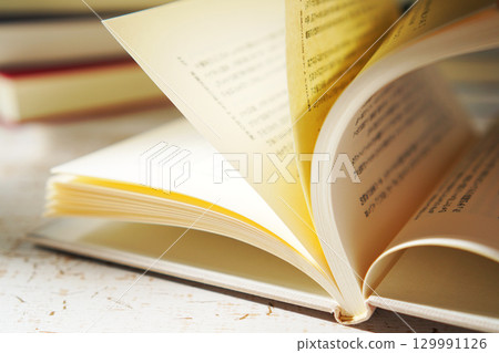 Autumn is the season for reading. Open a book (image) 129991126