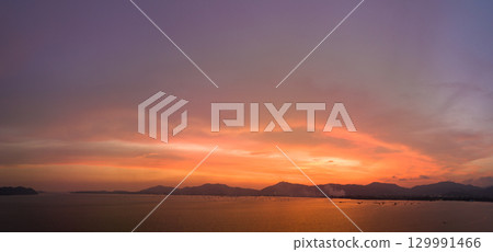 aerial view sunset landscape Amazing light of nature cloudscape sky above Phuket sea. aerial view sunset landscape Amazing light of nature cloudscape sky above Phuket sea. 129991466