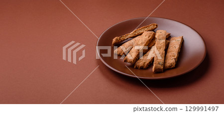 Biscotti or cantuccini biscuits, a crispy sweet Italian pastry. Biscotti dessert Biscotti or cantuccini biscuits, a crispy sweet Italian pastry. Biscotti dessert 129991497
