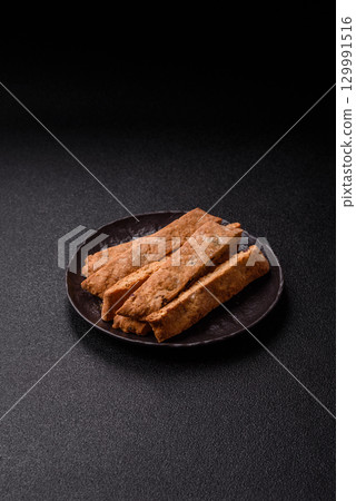 Biscotti or cantuccini biscuits, a crispy sweet Italian pastry. Biscotti dessert Biscotti or cantuccini biscuits, a crispy sweet Italian pastry. Biscotti dessert 129991516