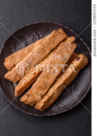 Biscotti or cantuccini biscuits, a crispy sweet Italian pastry. Biscotti dessert Biscotti or cantuccini biscuits, a crispy sweet Italian pastry. Biscotti dessert 129991519