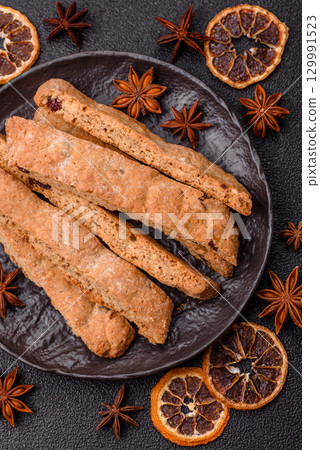 Biscotti or cantuccini biscuits, a crispy sweet Italian pastry. Biscotti dessert Biscotti or cantuccini biscuits, a crispy sweet Italian pastry. Biscotti dessert 129991523