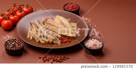 Dried salted fish, snacks or jerky, slices of white fish fillets Dried salted fish, snacks or jerky, slices of white fish fillets 129991570