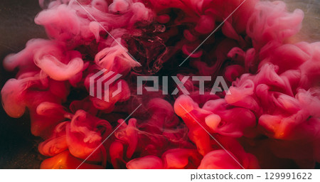 Pink swirl ink. Wave texture. Defocused vibrant color glitter shiny vapor liquid floating on abstract creative underwater background. 129991622