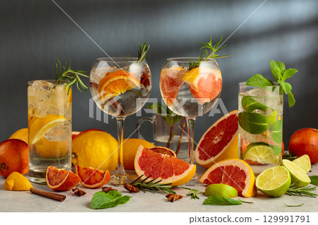 Refreshing summer drinks with ingredients on a white marble table. Refreshing summer drinks with ingredients on a white marble table. 129991791