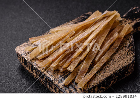 Food, snacks or jerky made from dried dehydrated salted fish with spices. Snacks fish Food, snacks or jerky made from dried dehydrated salted fish with spices. Snacks fish 129991834