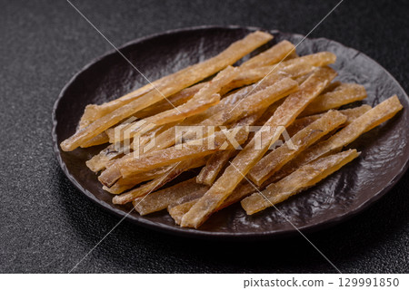 Food, snacks or jerky made from dried dehydrated salted fish with spices. Snacks fish Food, snacks or jerky made from dried dehydrated salted fish with spices. Snacks fish 129991850