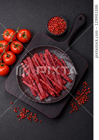 Jerky or dried chicken and cherry snacks. Dehydrated, dried snacks for beer Jerky or dried chicken and cherry snacks. Dehydrated, dried snacks for beer 129991886