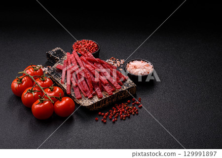 Jerky or dried chicken and cherry snacks. Dehydrated, dried snacks for beer Jerky or dried chicken and cherry snacks. Dehydrated, dried snacks for beer 129991897