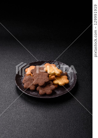 Sweet crispy biscuit with cocoa flavor, baking at home. Biscuit as a dessert Sweet crispy biscuit with cocoa flavor, baking at home. Biscuit as a dessert 129991919