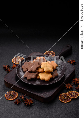 Sweet crispy biscuit with cocoa flavor, baking at home. Biscuit as a dessert Sweet crispy biscuit with cocoa flavor, baking at home. Biscuit as a dessert 129991934
