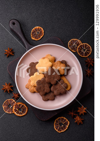 Sweet crispy biscuit with cocoa flavor, baking at home. Biscuit as a dessert Sweet crispy biscuit with cocoa flavor, baking at home. Biscuit as a dessert 129991936
