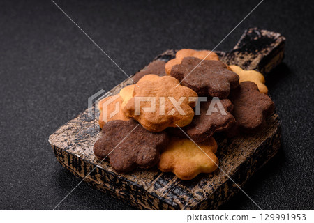 Sweet crispy biscuit with cocoa flavor, baking at home. Biscuit as a dessert Sweet crispy biscuit with cocoa flavor, baking at home. Biscuit as a dessert 129991953