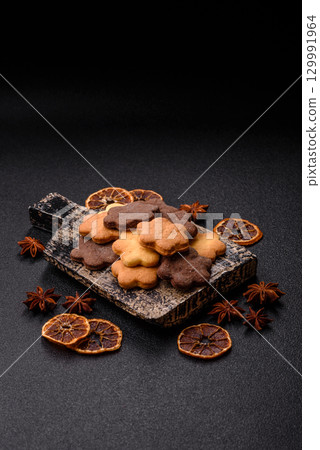 Sweet crispy biscuit with cocoa flavor, baking at home. Biscuit as a dessert 129991964