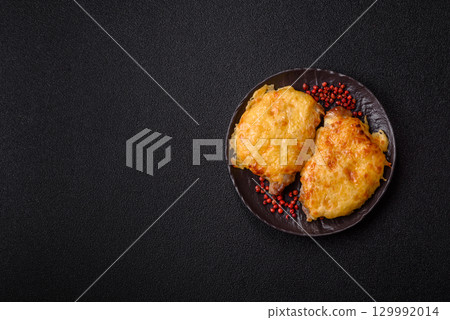 Steak, a pork or chicken chop covered with melted cheese. Grilled meat 129992014