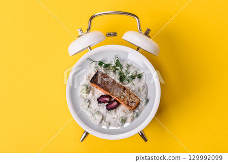 Red salmon fish grilled with pepper and spices. Concept time to eat fish Red salmon fish grilled with pepper and spices. Concept time to eat fish 129992099
