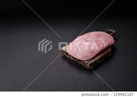 Sliced ham, meat or pork sausage for sandwiches. Cooked smoked prosciutto, ham 129992187