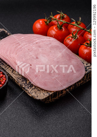 Sliced ham, meat or pork sausage for sandwiches. Cooked smoked prosciutto, ham 129992196