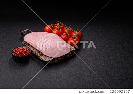 Sliced ham, meat or pork sausage for sandwiches. Cooked smoked prosciutto, ham 129992197