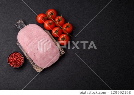 Sliced ham, meat or pork sausage for sandwiches. Cooked smoked prosciutto, ham 129992198