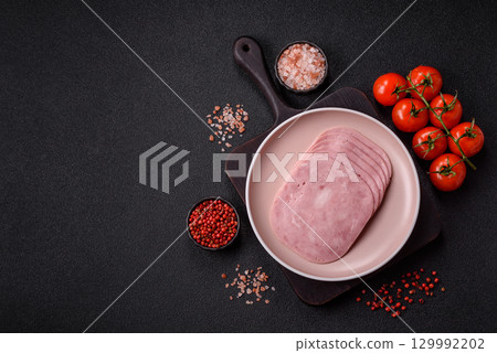 Sliced ham, meat or pork sausage for sandwiches. Cooked smoked prosciutto, ham 129992202