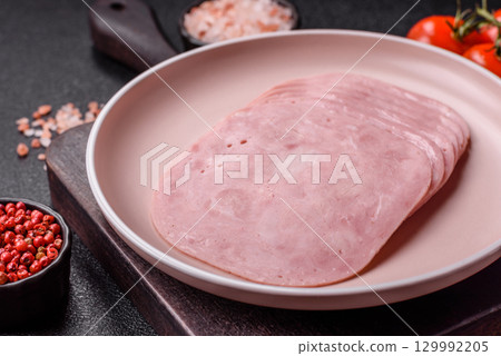 Sliced ham, meat or pork sausage for sandwiches. Cooked smoked prosciutto, ham Sliced ham, meat or pork sausage for sandwiches. Cooked smoked prosciutto, ham 129992205