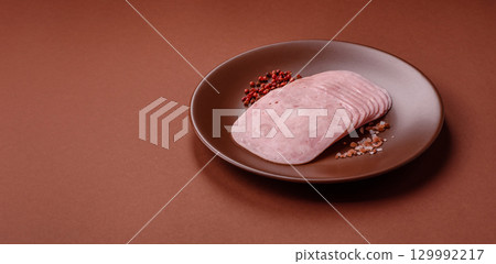 Sliced ham, meat or pork sausage for sandwiches. Cooked smoked prosciutto, ham Sliced ham, meat or pork sausage for sandwiches. Cooked smoked prosciutto, ham 129992217