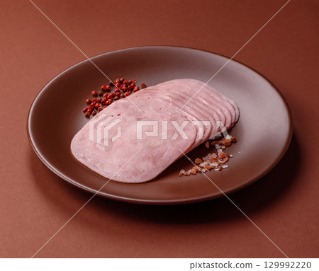 Sliced ham, meat or pork sausage for sandwiches. Cooked smoked prosciutto, ham 129992220