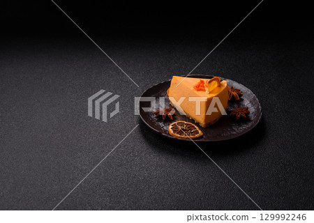 A slice of yellow cheesecake cake flavored with lemon and passion fruit A slice of yellow cheesecake cake flavored with lemon and passion fruit 129992246
