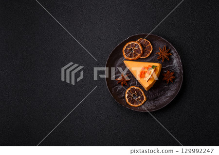 A slice of yellow cheesecake cake flavored with lemon and passion fruit A slice of yellow cheesecake cake flavored with lemon and passion fruit 129992247