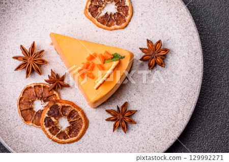 A slice of yellow cheesecake cake flavored with lemon and passion fruit 129992271