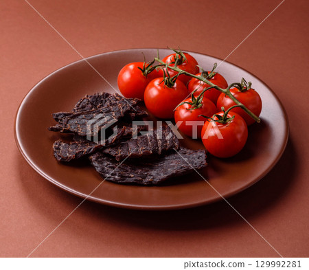 Snacks or jerky, beef slice meat dried, dehydrated. Beef snack Snacks or jerky, beef slice meat dried, dehydrated. Beef snack 129992281