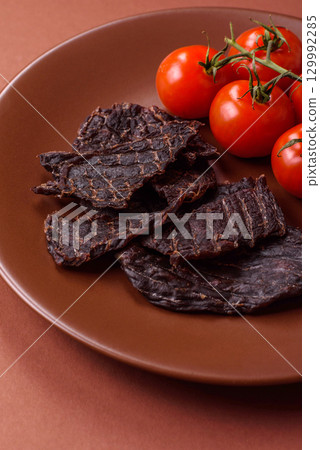 Snacks or jerky, beef slice meat dried, dehydrated. Beef snack Snacks or jerky, beef slice meat dried, dehydrated. Beef snack 129992285