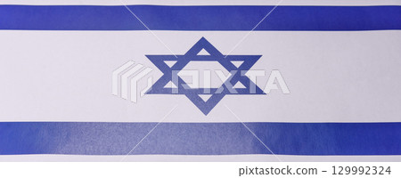 Israeli flag in white and blue colors as a symbol of independence. Flag of Israel Israeli flag in white and blue colors as a symbol of independence. Flag of Israel 129992324