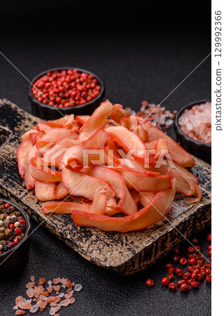 Food, dried squid in shavings or chopped as snacks or jerky. Snack dried squid for beer Food, dried squid in shavings or chopped as snacks or jerky. Snack dried squid for beer 129992366