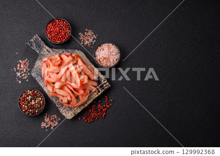 Food, dried squid in shavings or chopped as snacks or jerky. Snack dried squid for beer Food, dried squid in shavings or chopped as snacks or jerky. Snack dried squid for beer 129992368