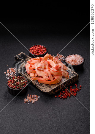 Food, dried squid in shavings or chopped as snacks or jerky. Snack dried squid for beer Food, dried squid in shavings or chopped as snacks or jerky. Snack dried squid for beer 129992370