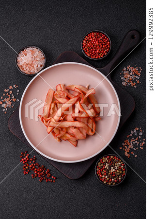 Food, dried squid in shavings or chopped as snacks or jerky. Snack dried squid for beer 129992385