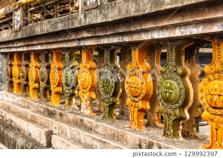 Colorful ancient ceramic balustrade with ornamental patterns at the Imperial City of Hue Vietnam Colorful ancient ceramic balustrade with ornamental patterns at the Imperial City of Hue Vietnam 129992397