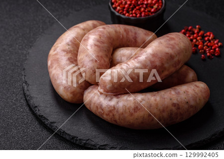 Raw meat sausages made from beef or pork, fresh meat for barbecuing or grilling. Raw sausages Raw meat sausages made from beef or pork, fresh meat for barbecuing or grilling. Raw sausages 129992405