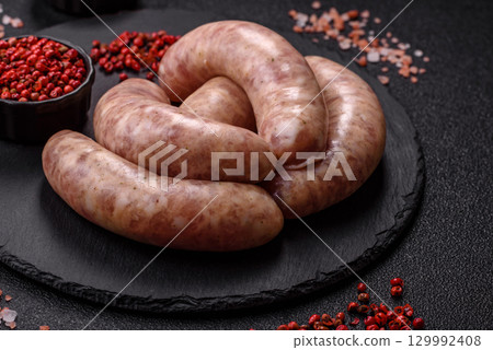 Raw meat sausages made from beef or pork, fresh meat for barbecuing or grilling. Raw sausages Raw meat sausages made from beef or pork, fresh meat for barbecuing or grilling. Raw sausages 129992408