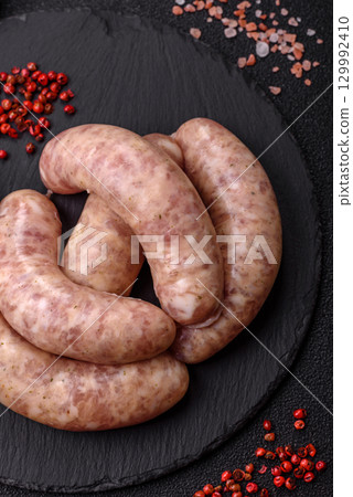 Raw meat sausages made from beef or pork, fresh meat for barbecuing or grilling. Raw sausages 129992410