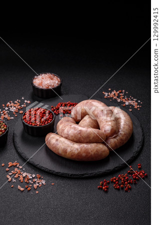 Raw meat sausages made from beef or pork, fresh meat for barbecuing or grilling. Raw sausages Raw meat sausages made from beef or pork, fresh meat for barbecuing or grilling. Raw sausages 129992415