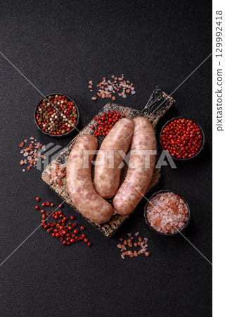 Raw meat sausages made from beef or pork, fresh meat for barbecuing or grilling. Raw sausages Raw meat sausages made from beef or pork, fresh meat for barbecuing or grilling. Raw sausages 129992418