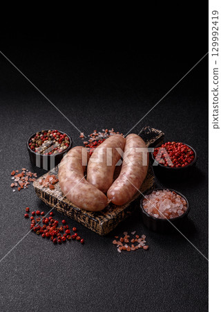 Raw meat sausages made from beef or pork, fresh meat for barbecuing or grilling. Raw sausages Raw meat sausages made from beef or pork, fresh meat for barbecuing or grilling. Raw sausages 129992419