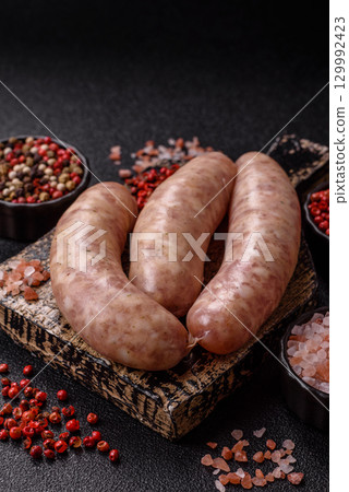 Raw meat sausages made from beef or pork, fresh meat for barbecuing or grilling. Raw sausages 129992423