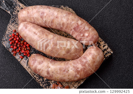 Raw meat sausages made from beef or pork, fresh meat for barbecuing or grilling. Raw sausages 129992425