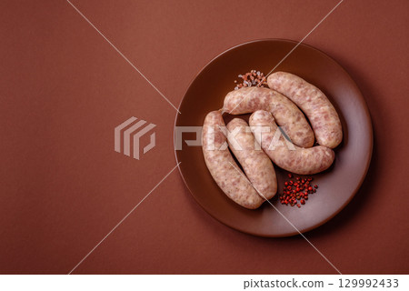 Raw meat sausages made from beef or pork, fresh meat for barbecuing or grilling. Raw sausages Raw meat sausages made from beef or pork, fresh meat for barbecuing or grilling. Raw sausages 129992433