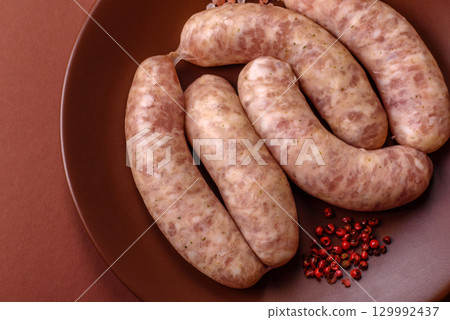Raw meat sausages made from beef or pork, fresh meat for barbecuing or grilling. Raw sausages 129992437